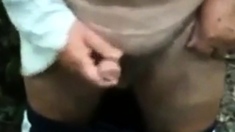 Old man wanking his uncut cock outside