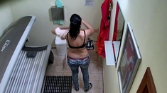 Busty dark haired girl in solarium
