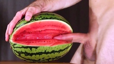 Muscular Stud Fucks and Cums on Watermelon