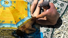 Public beach sex of a voyeur horny couple